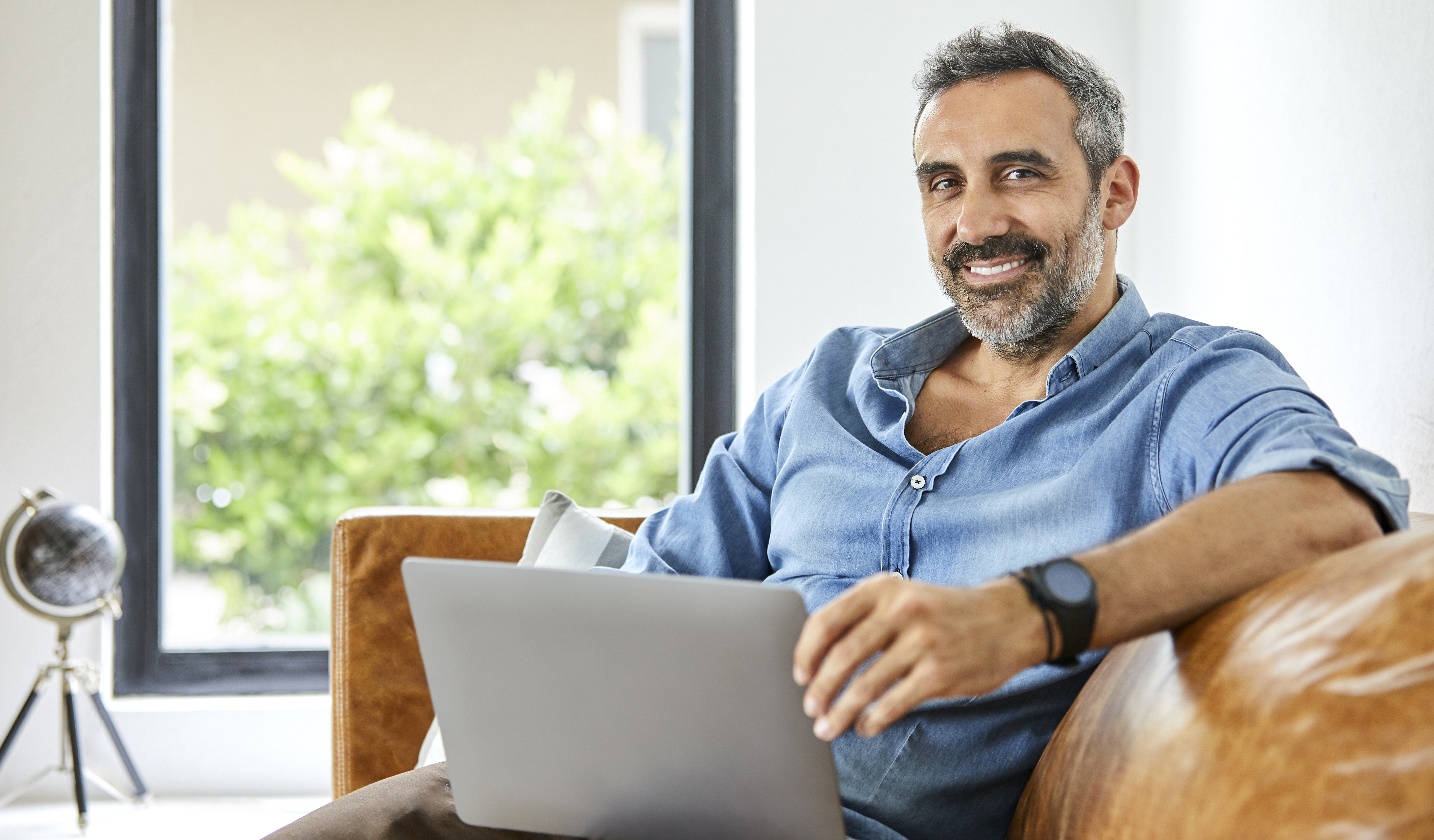 Man on his computer and smiling